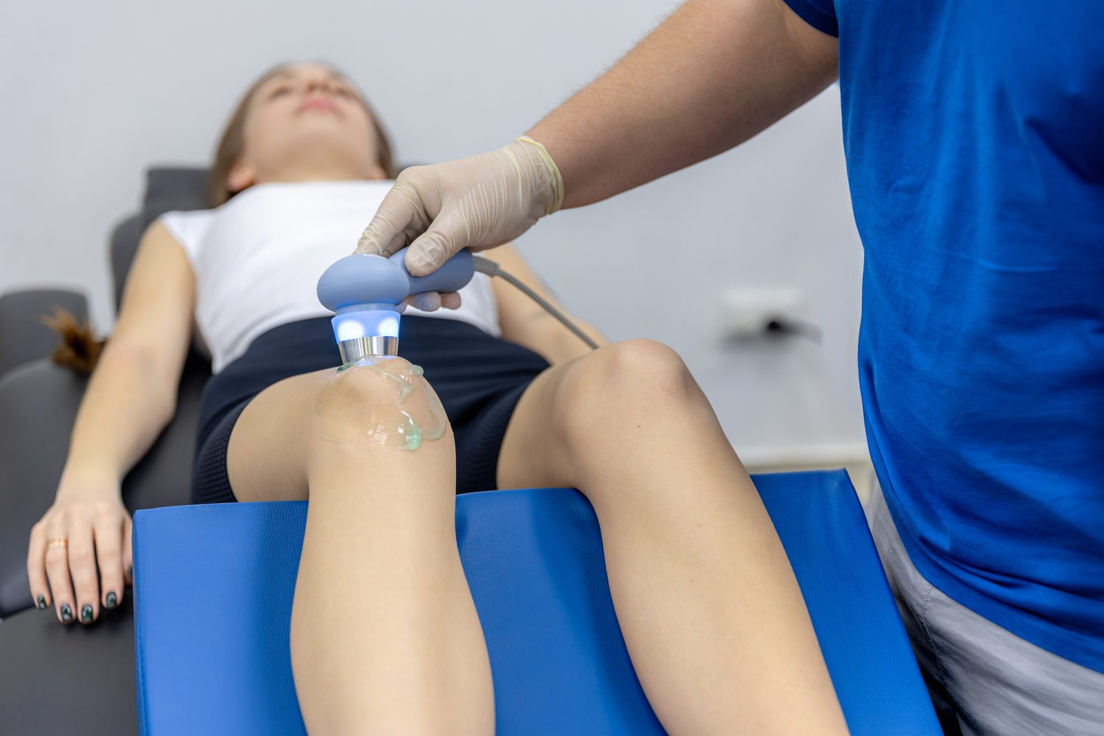 Knee Surgery Terminology Guide 2 doctor-checks-collarbone-shoulder-female-patient-rehab-pain-assessment
