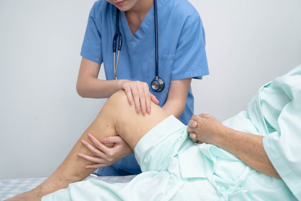 How Do You Know If You Need a Knee Replacement? 13 doctor checking asian elderly woman patient with scar knee replacement surgery hospital