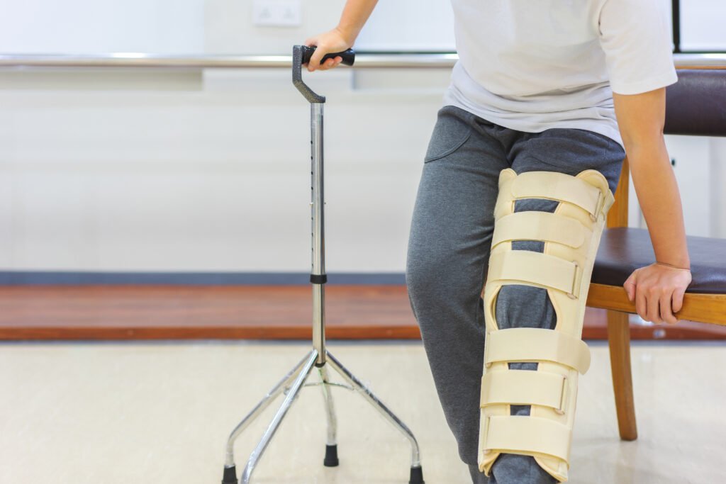 Knee Replacement Recovery Week by Week: The Complete Timeline 25 female patients wear knee support devices reduce movement while using cane get up from chair