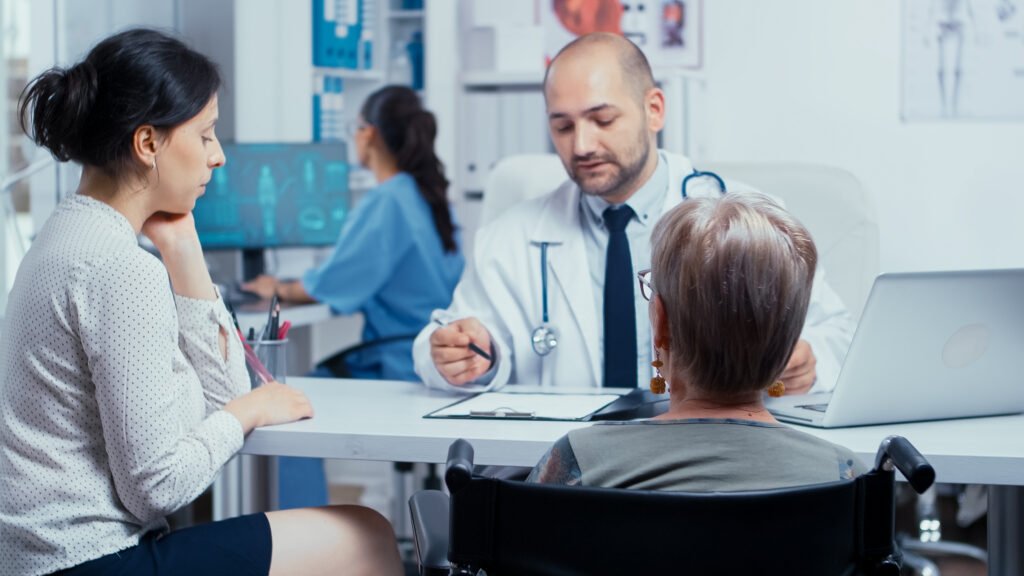 Does Medicare Cover Knee Replacement in Australia? 16 woman wheelchair with her daughter annual doctor appointment selective focus dsabled disability handicapped old person treatment modern private hospital clinic medicine health care