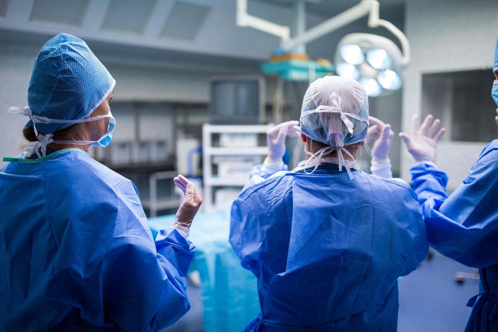 rear-view-surgeons-preparing-operation-operation-room