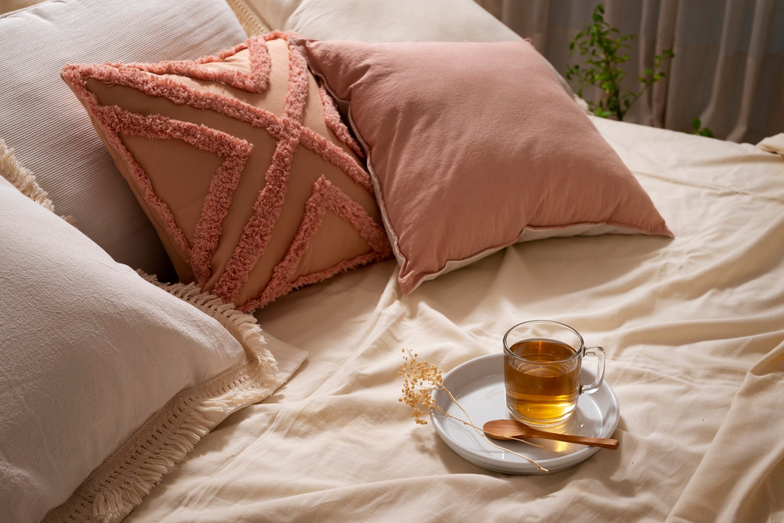 high-angle-cozy-bed-arrangement-with-tea