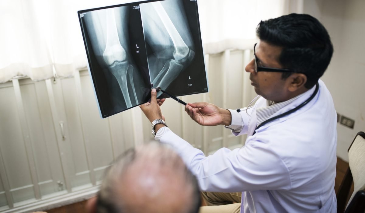 doctor-with-patient-s-x-ray-film
