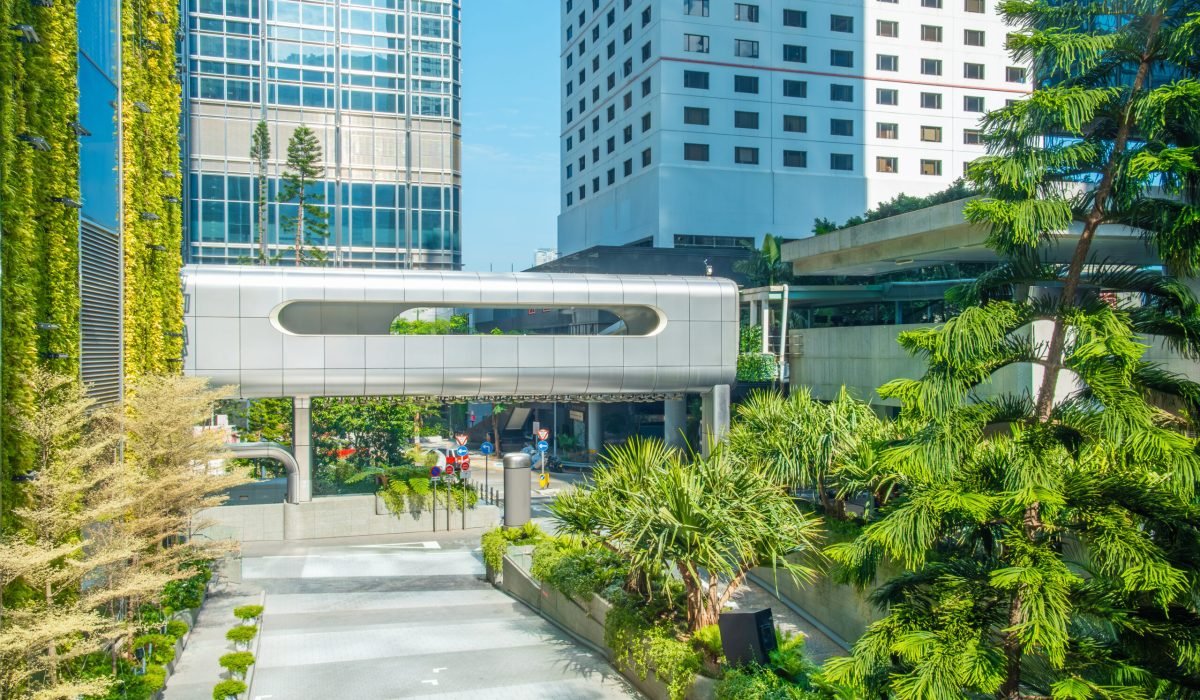 futuristic-elevated-walkway-with-surrounding-greenery-modern-buildings-hong-kong-city-china
